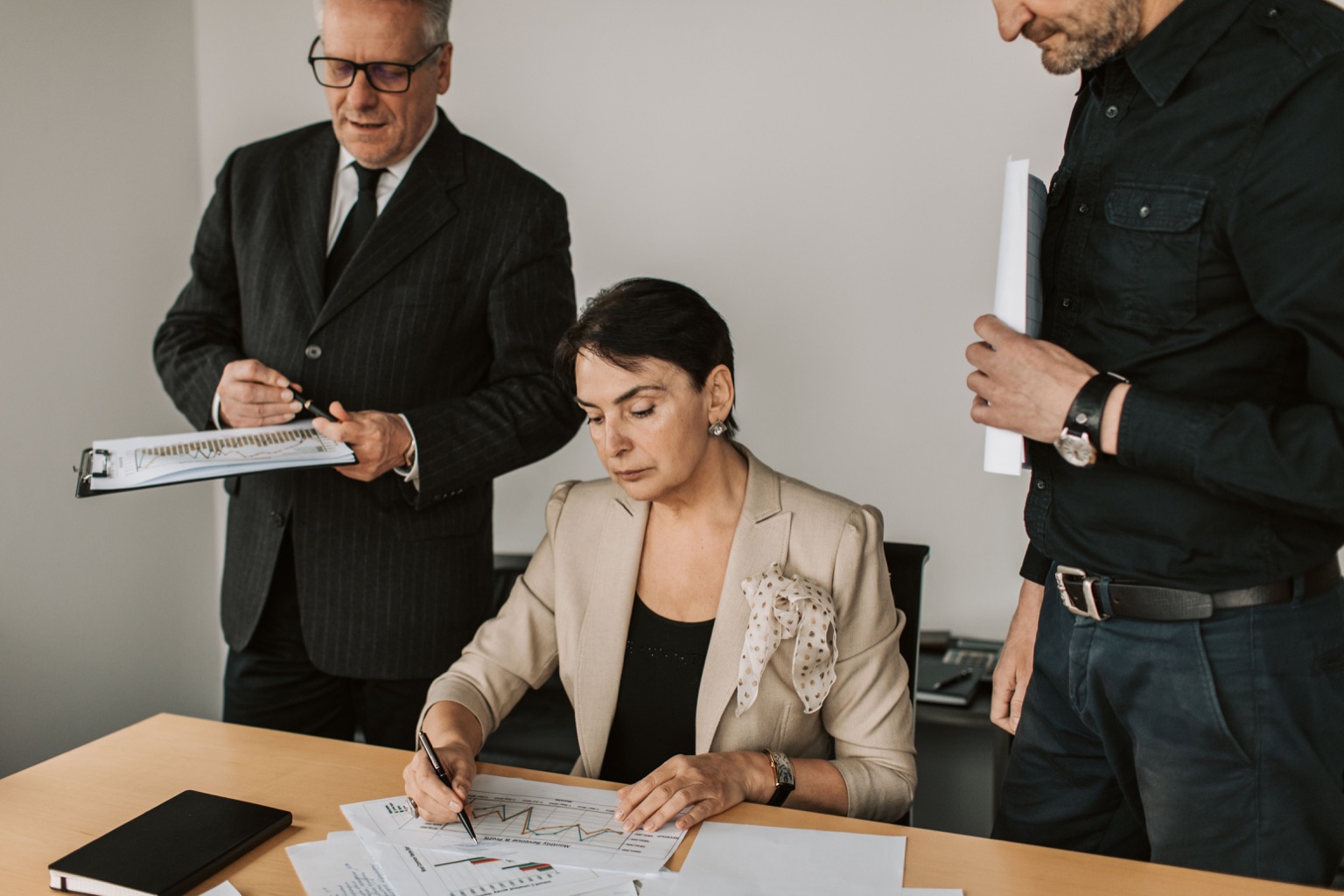Finance leaders reviewing reports before a meeting